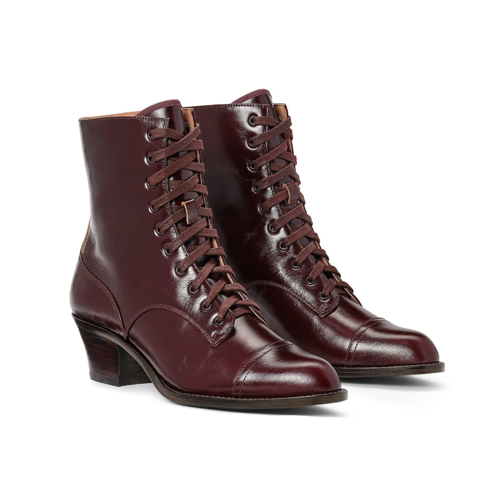 Pair of brown leather boots on a white background